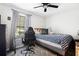 Bedroom featuring a desk, ceiling fan, and a large window at 2022 Ramblewood Ne Ct, Marietta, GA 30062