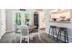 Inviting dining area with deck access, adjacent to a modern kitchen and breakfast bar at 2022 Ramblewood Ne Ct, Marietta, GA 30062
