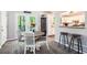 Bright dining area with a round table, seating for four, and a view of the kitchen bar at 2022 Ramblewood Ne Ct, Marietta, GA 30062