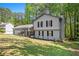 Charming two-story home with a manicured lawn and mature trees, offering a serene and inviting curb appeal at 2022 Ramblewood Ne Ct, Marietta, GA 30062