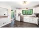 Bright kitchen featuring white cabinets, stainless dishwasher and a nature view at 2022 Ramblewood Ne Ct, Marietta, GA 30062