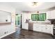 Spacious kitchen with stainless steel appliances, white cabinets, and backyard access to a deck at 2022 Ramblewood Ne Ct, Marietta, GA 30062