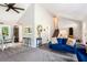 Bright living room with vaulted ceiling, gray carpet, and comfortable seating near dining area at 2022 Ramblewood Ne Ct, Marietta, GA 30062