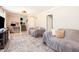 Open-concept living area with seating, a workspace, and stairs to the second floor at 2022 Ramblewood Ne Ct, Marietta, GA 30062
