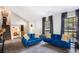 Spacious living area with vaulted ceilings, with plush sofas, and large bright windows at 2022 Ramblewood Ne Ct, Marietta, GA 30062