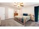 Main bedroom featuring plush carpet, ceiling fan, and natural light through the window at 2022 Ramblewood Ne Ct, Marietta, GA 30062