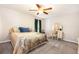 Cozy main bedroom with a large bed, ceiling fan, and vanity table with mirrors at 2022 Ramblewood Ne Ct, Marietta, GA 30062