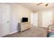 Bedroom featuring plush carpet, a dresser with tv, and two closets for ample storage at 2022 Ramblewood Ne Ct, Marietta, GA 30062