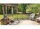 Outdoor deck with lush green surroundings, perfect for relaxation and entertaining at 4909 Woodhurst Way, Stone Mountain, GA 30088