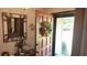 Welcoming entryway with decorative mirror, wreath, and tile flooring at 4909 Woodhurst Way, Stone Mountain, GA 30088