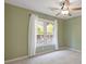 Bedroom with window, neutral walls, and a ceiling fan at 1970 Glen Eves Dr, Roswell, GA 30076