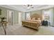 Bedroom features a ceiling fan, neutral carpet, and light green walls for a relaxing space at 1970 Glen Eves Dr, Roswell, GA 30076
