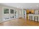 Dining area with hardwood floors, large windows, and access to the kitchen and outdoor deck at 1970 Glen Eves Dr, Roswell, GA 30076