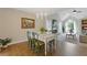 Stylish dining area connected to the living room, featuring a table for four and a view of the cozy fireplace at 1970 Glen Eves Dr, Roswell, GA 30076