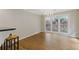 Bright dining area with hardwood floors, large windows, and a chandelier at 1970 Glen Eves Dr, Roswell, GA 30076
