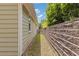 A side yard with a tall retaining wall creating a unique boundary at 1970 Glen Eves Dr, Roswell, GA 30076