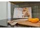Close up of kitchen countertop with recipe book, oranges, and a stylish dish towel at 1970 Glen Eves Dr, Roswell, GA 30076