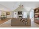 Spacious living room and dining area with vaulted ceilings, fireplace, and large windows providing ample natural light at 1970 Glen Eves Dr, Roswell, GA 30076