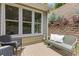 Inviting outdoor patio with seating, overlooking the landscaped retaining wall at 1970 Glen Eves Dr, Roswell, GA 30076
