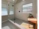 Walk-in shower featuring a glass partition and stylish tile floors at 1970 Glen Eves Dr, Roswell, GA 30076