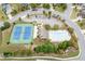 Community amenities featuring tennis courts, swimming pool, clubhouse, parking, and well-maintained landscaping at 3097 Trinity Grove Dr, Dacula, GA 30019