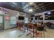 Entertainer's dream with a custom bar setup, multiple TVs, and seating for sports enthusiasts at 3097 Trinity Grove Dr, Dacula, GA 30019