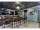 Fully equipped bar area with sports-themed decor, multiple TVs, and ample seating, designed for ultimate entertainment at 3097 Trinity Grove Dr, Dacula, GA 30019