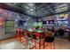 Vibrant bar setup with numerous screens, themed decor, and seating, perfect for sports fans and social events at 3097 Trinity Grove Dr, Dacula, GA 30019