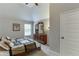 Bedroom featuring a dresser with mirror, neutral tones, and a ceiling fan at 3097 Trinity Grove Dr, Dacula, GA 30019