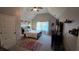 This cozy bedroom features a bed, a desk, a dresser, a ceiling fan, and a window at 3097 Trinity Grove Dr, Dacula, GA 30019