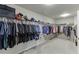 This walk-in closet is spacious, with racks and shelves for optimal storage and organization of clothes, shoes, and more at 3097 Trinity Grove Dr, Dacula, GA 30019
