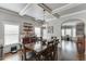 Formal dining area featuring coffered ceilings, hardwood floors, and modern decor at 3097 Trinity Grove Dr, Dacula, GA 30019