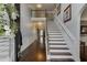Inviting foyer with hardwood floors and a staircase leading to the second floor at 3097 Trinity Grove Dr, Dacula, GA 30019