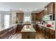 Beautiful kitchen with granite counters, an island, tile backsplash, and stainless steel appliances at 3097 Trinity Grove Dr, Dacula, GA 30019