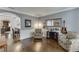 Inviting living room with hardwood floors, comfortable seating, and elegant archway at 3097 Trinity Grove Dr, Dacula, GA 30019