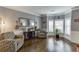 Cozy living room with hardwood floors, large windows, and stylish decor at 3097 Trinity Grove Dr, Dacula, GA 30019