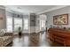Bright living room with hardwood floors, large windows, and elegant crown molding at 3097 Trinity Grove Dr, Dacula, GA 30019