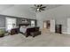 Large main bedroom featuring neutral carpet, a tray ceiling, and an ensuite bathroom at 3097 Trinity Grove Dr, Dacula, GA 30019
