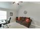 Comfortable office space with a sofa, desk, and natural light, ideal for working from home at 3097 Trinity Grove Dr, Dacula, GA 30019