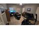 Functional office space with a sofa, desk, and natural light, ideal for working from home or home gym at 3097 Trinity Grove Dr, Dacula, GA 30019