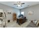 Functional office space with a sofa, desk, and natural light, ideal for working from home or home gym at 3097 Trinity Grove Dr, Dacula, GA 30019