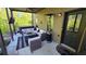 Covered patio with an outdoor seating area, fire pit, and hot tub at 3097 Trinity Grove Dr, Dacula, GA 30019