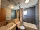 Bathroom featuring a tiled shower/tub and a modern sink, maximizing space and functionality at 562 Formwalt Sw St # 4, Atlanta, GA 30312