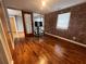 Bedroom with hardwood floors and exposed brick accent wall, offering unique urban charm at 562 Formwalt Sw St # 4, Atlanta, GA 30312