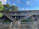Attractive apartment complex with wooden stairs and white picket fence around a stone base at 562 Formwalt Sw St # 4, Atlanta, GA 30312