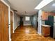 Bright living room featuring hardwood floors and a stylish glass divider, creating an inviting space at 562 Formwalt Sw St # 4, Atlanta, GA 30312