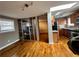 Open living space with modern lighting and hardwood floors with kitchen featuring modern appliances at 562 Formwalt Sw St # 4, Atlanta, GA 30312