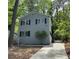 Charming two-story home with gray siding, black shutters, and a newly poured concrete driveway at 948 Reed Ave, Atlanta, GA 30344