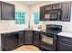 Updated kitchen with granite countertops, subway tile backsplash, and stainless steel appliances at 948 Reed Ave, Atlanta, GA 30344