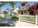 Beautiful home with a white picket fence and well-manicured landscaping in a desirable neighborhood at 168 Brighton Blvd, Woodstock, GA 30188